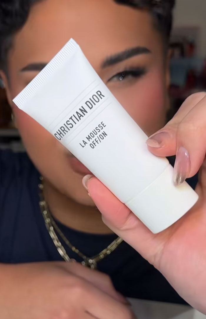 Person holding a Christian Dior skincare product, highlighting luxury beauty items from the Dior advent calendar collection. Person holding a Christian Dior skincare product, highlighting luxury beauty items from the Dior advent calendar collection.