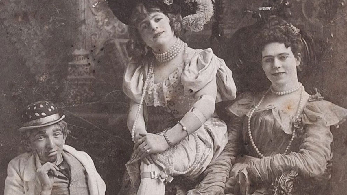 Victorian-Edwardian pictures showing three women in period costumes posing indoors with vintage accessories and hats.