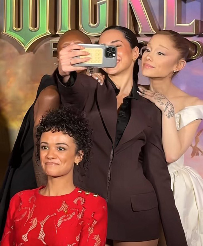 Wicked cast taking a selfie at event, sparking debate on disability inclusion after Marissa Bode was excluded from the photo. Wicked cast taking a selfie at event, sparking debate on disability inclusion after Marissa Bode was excluded from the photo.