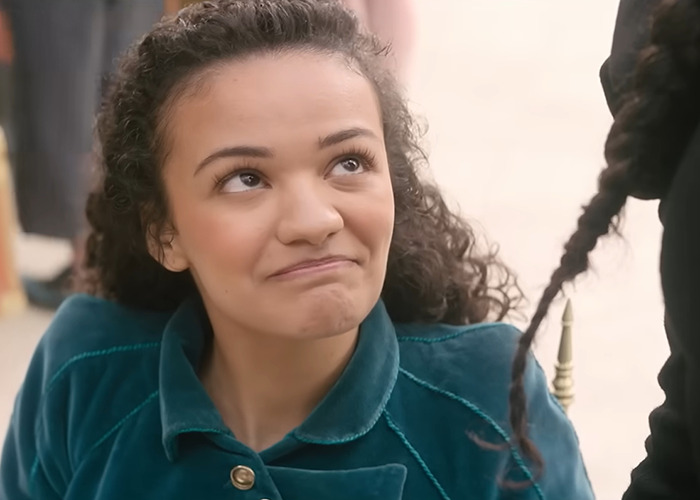 Actress from Wicked cast reacting in a candid moment during a discussion on disability inclusion and viral selfie controversy. Actress from Wicked cast reacting in a candid moment during a discussion on disability inclusion and viral selfie controversy.