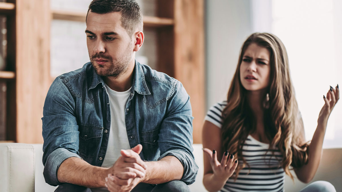 Man ignoring domestic chores and wife expressing frustration over expected dinner service at home.