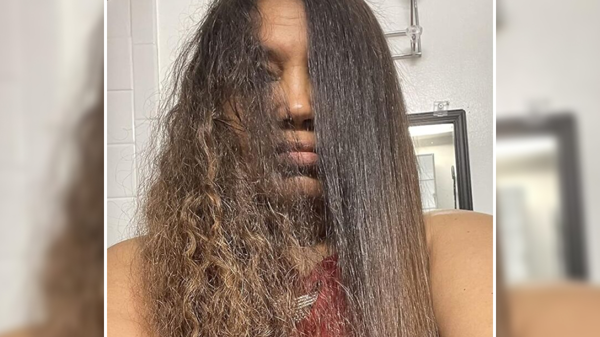 Half of a woman's hair is frizzy and dry while the other half is smooth and straight, showing winter beauty problems solution.