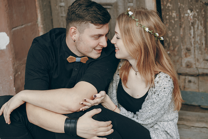 Young man happy and smiling while sitting close to woman, symbolizing man happy ex wife caught cheating emotion. Young man happy and smiling while sitting close to woman, symbolizing man happy ex wife caught cheating emotion.