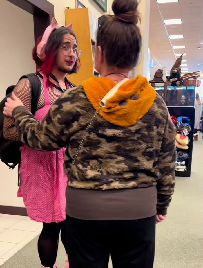 Woman upset confronting bearded trans man in public space sparking debate about transgender use of women’s restroom. Woman upset confronting bearded trans man in public space sparking debate about transgender use of women’s restroom.