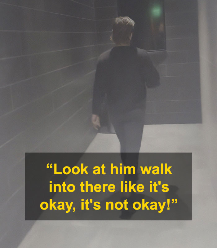 Person walking down dimly lit hallway with text about confrontation involving alleged trans woman in ladies room controversy. Person walking down dimly lit hallway with text about confrontation involving alleged trans woman in ladies room controversy.