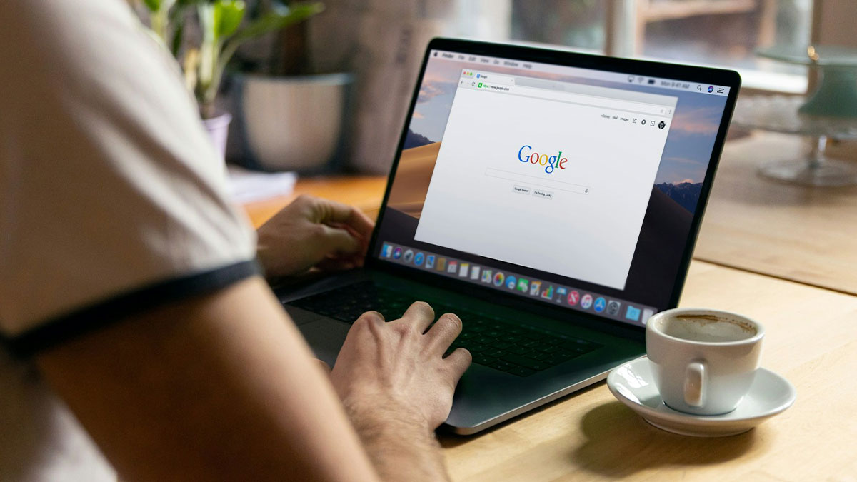 Person using a laptop with a search engine open, illustrating workers share unprofessional things done at work.