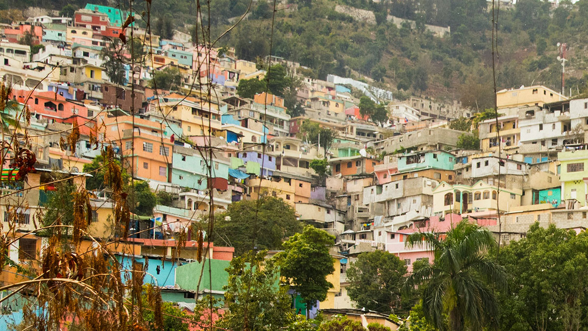 Colorful houses densely packed on a hillside in one of the worst cities worldwide you should never visit.