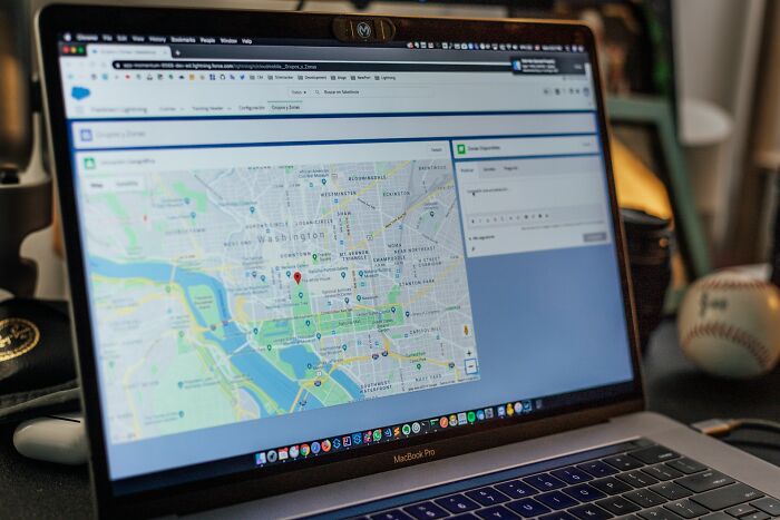 Laptop screen showing a map with location markers, symbolizing subtle signs that indicate they’re cheating once noticed.