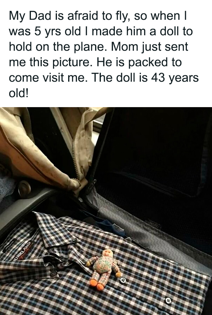 Vintage doll packed in suitcase with checkered shirt, a sweet and wholesome moment to cleanse your feed.