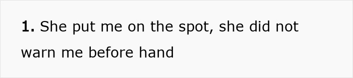 Woman standing firm, not giving in to social pressure from coworkers, remaining confident despite awkwardness.