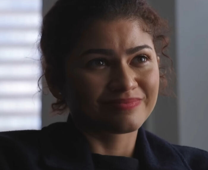 Zendaya smiling warmly in a close-up shot, related to Robert Pattinson and Zendaya engagement viral ad news.