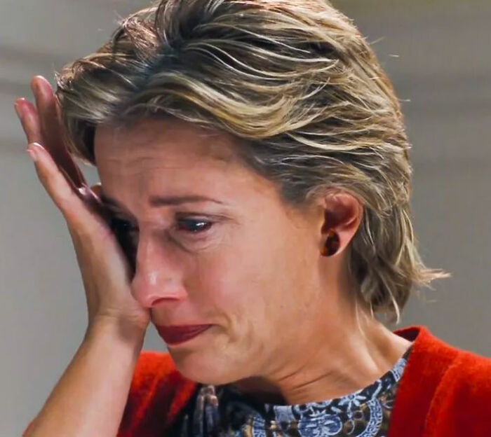 Woman wiping tears from her face in a close-up scene relating to Timothée Chalamet Love Actually misread reaction. Woman wiping tears from her face in a close-up scene relating to Timothée Chalamet Love Actually misread reaction.
