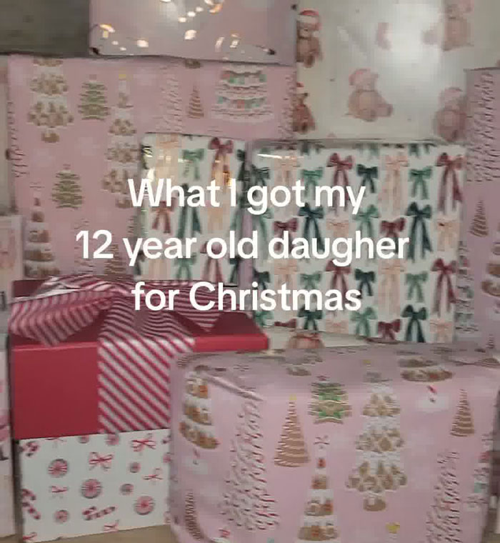 Christmas gift haul for daughter showing various wrapped presents with festive patterns and bows.