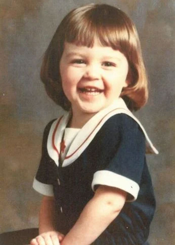Smiling young child in navy and white outfit, representing a child kidnapped from Kentucky in 1983 found alive decades later. Smiling young child in navy and white outfit, representing a child kidnapped from Kentucky in 1983 found alive decades later.