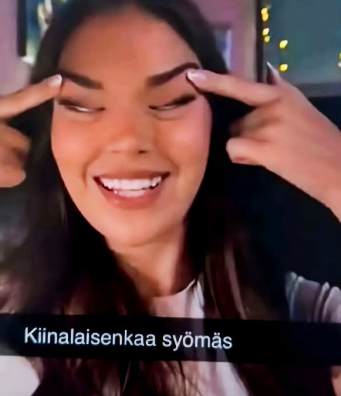 Beauty queen making racist gesture with fingers by eyes, related to Japan government and Finland controversy. Beauty queen making racist gesture with fingers by eyes, related to Japan government and Finland controversy.
