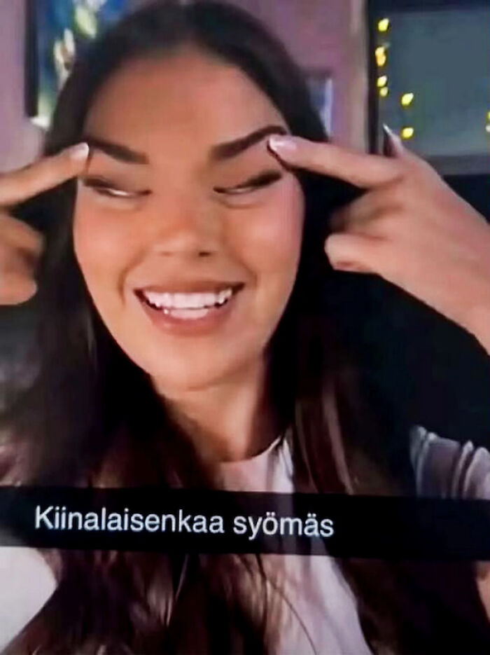 Young woman smiling and making a controversial gesture, linked to Miss Finland losing crown after racist backlash on social media. Young woman smiling and making a controversial gesture, linked to Miss Finland losing crown after racist backlash on social media.