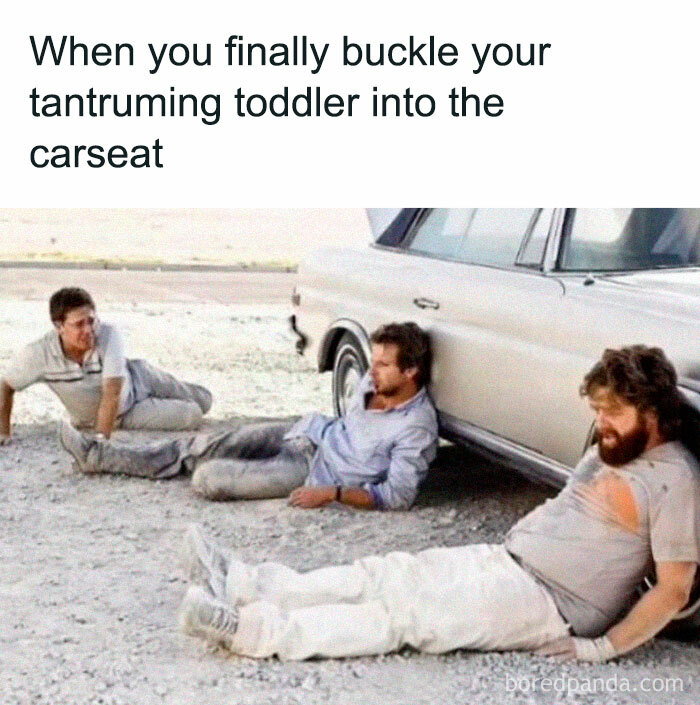Three exhausted men sitting on the ground beside a car, illustrating funny and savage parenting memes about toddlers.