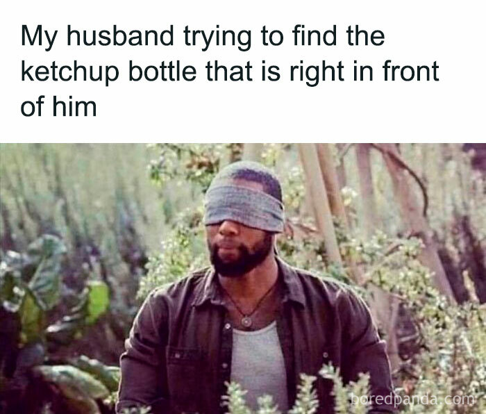 Man blindfolded humorously searching, illustrating a funny and savage parenting meme about everyday challenges with kids.