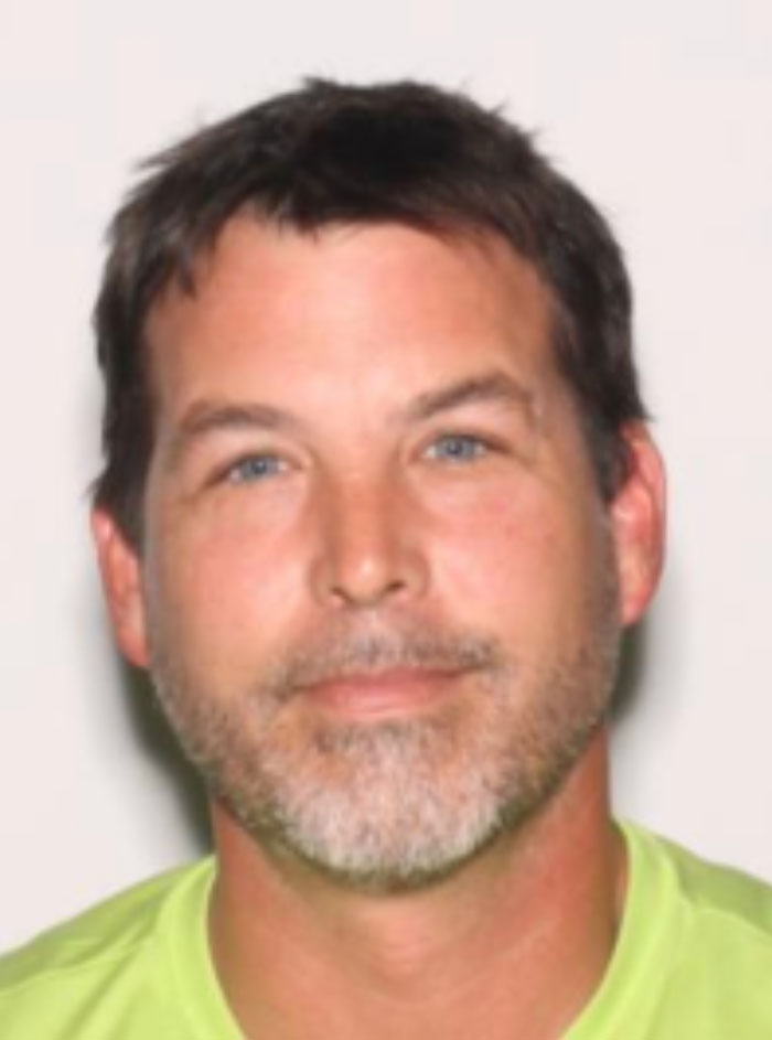 Close-up of a man with short dark hair and blue eyes related to a heated NFL argument with family. Close-up of a man with short dark hair and blue eyes related to a heated NFL argument with family.