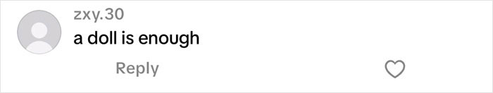 Screenshot of a social media comment saying "a doll is enough" related to Christmas gift haul for daughter backlash.