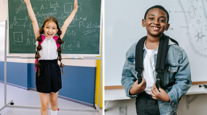 Girl in school uniform with arms raised by chalkboard and boy in casual wear smiling with backpack indoors.