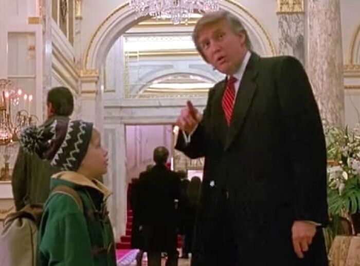 A man in a suit talks to a child in a hat inside a mansion, hinting at people think celebrities closet skeletons.