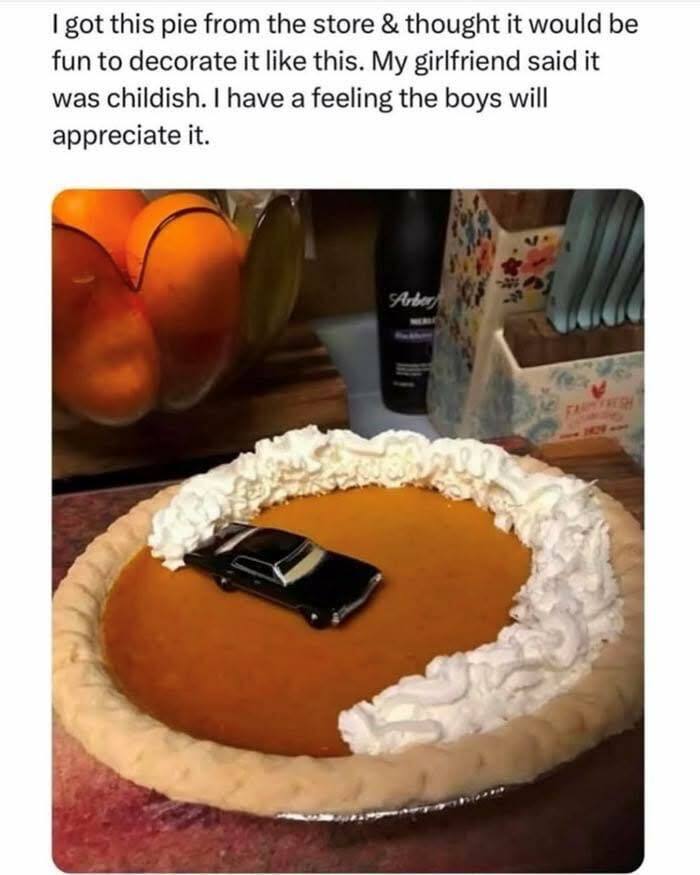 Pumpkin pie decorated with whipped cream and a toy car creating a humorous scene for hilarious memes about stress relief.