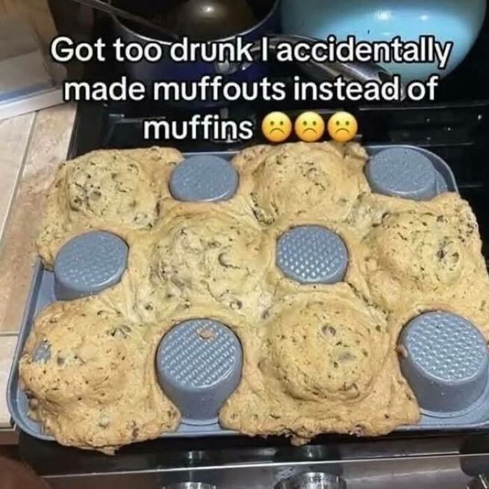 Overbaked muffouts spilling out of a muffin tray with a humorous text about making muffins while drunk.