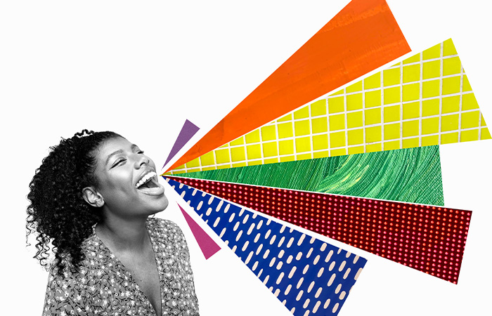 Woman smiling with colorful abstract shapes coming from her mouth, representing traits men find attractive in women.