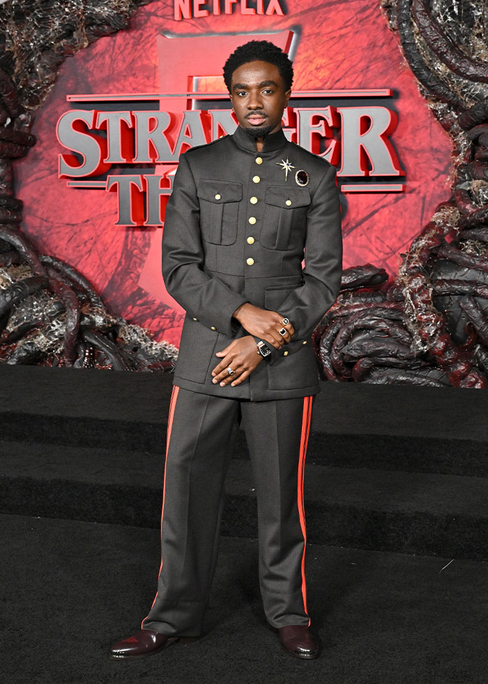 Actor at a Stranger Things event wearing a military-style outfit noted in celebrity fashion disasters 2025.