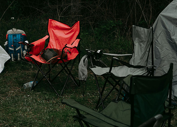 Outdoor camping chairs set up in a remote and isolated place, hinting at creepy and mysterious witness experiences.