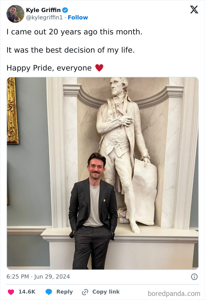 Man standing confidently in front of a statue, symbolizing taking a leap of faith and making life-changing decisions.