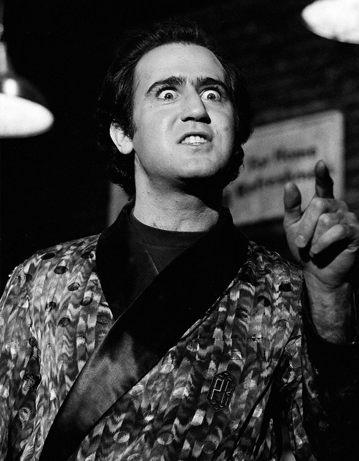 Actor in a dramatic scene wearing a patterned robe, illustrating outrageous demands actors include in contracts.