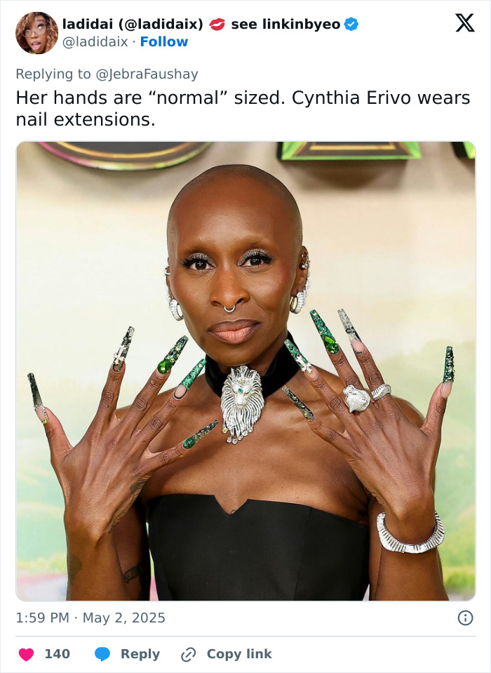 Cynthia Erivo showing hands with long green nail extensions, sparking debate over oddly large hands appearance. Cynthia Erivo showing hands with long green nail extensions, sparking debate over oddly large hands appearance.