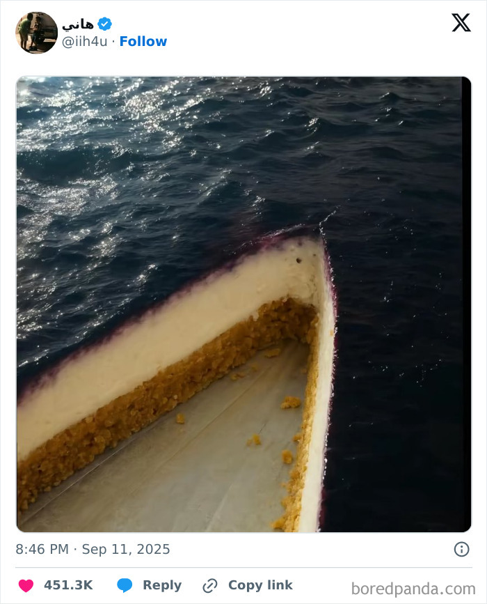 Slice of cheesecake blending with water to create a confusing photo that challenges your brain to catch up.