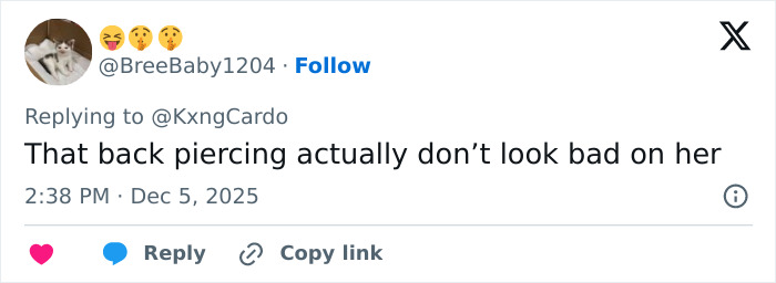 Social media user commenting on Cardi B’s new neck and back piercings amid mixed reactions online.