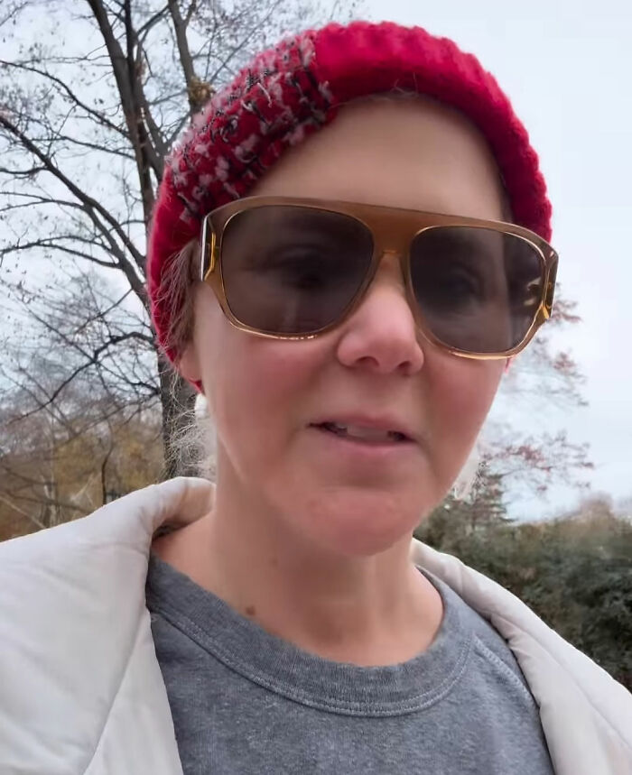 Amy Schumer wearing sunglasses and a red beanie outdoors showing off dramatic weight loss in casual attire. Amy Schumer wearing sunglasses and a red beanie outdoors showing off dramatic weight loss in casual attire.