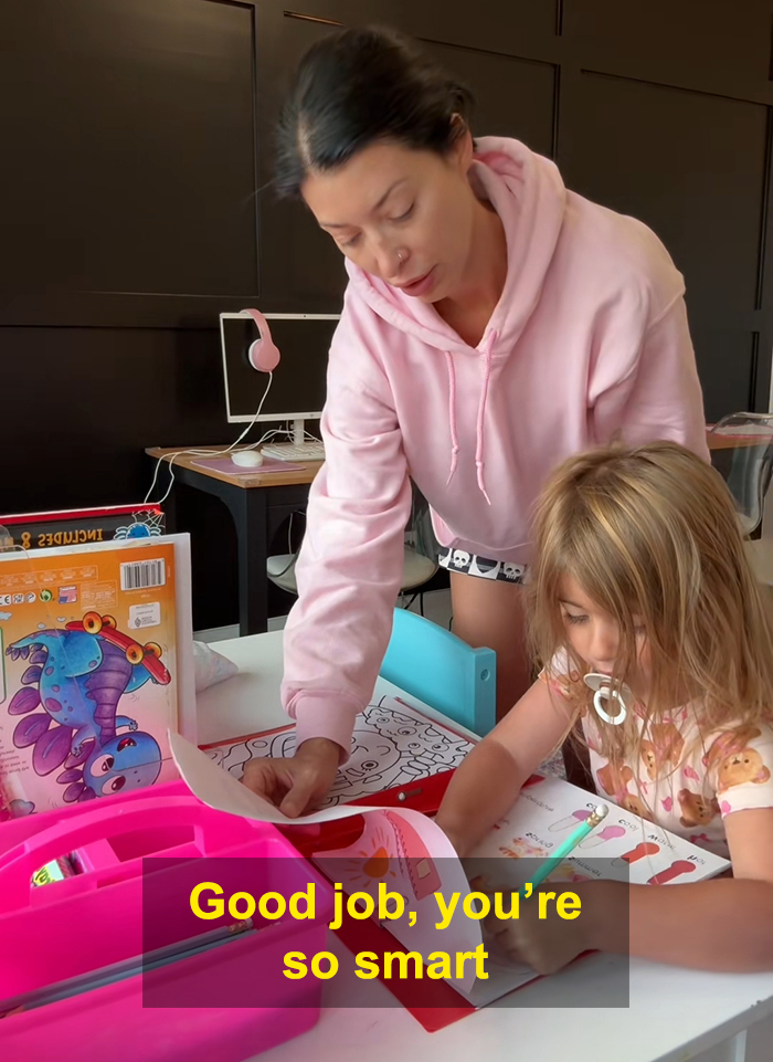 Woman homeschooling child at a table with books and supplies, highlighting viral homeschool clip raising parenting questions.
