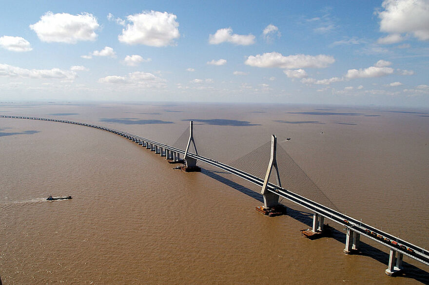 Aerial view of remarkable engineering on one of the 12 longest bridges in the world stretching over water.