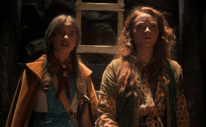 Two female characters from Stranger Things 5 looking tense in a dimly lit, rustic setting, highlighting comically bad scenes. Two female characters from Stranger Things 5 looking tense in a dimly lit, rustic setting, highlighting comically bad scenes.