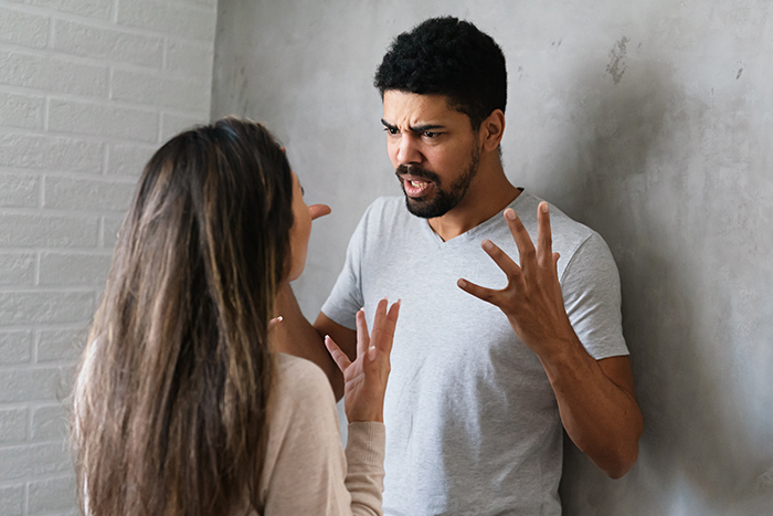 Woman and man arguing intensely, highlighting family intervention and obsession issues leading to hospitalization. Woman and man arguing intensely, highlighting family intervention and obsession issues leading to hospitalization.