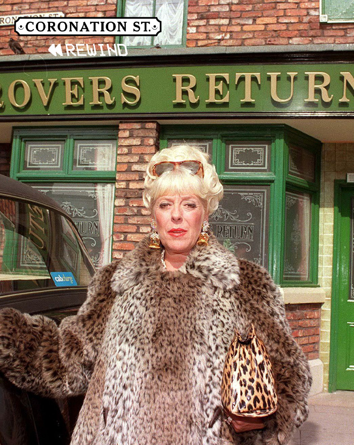 Blonde woman wearing a large leopard print fur coat and holding a leopard handbag outside a TV show set for longest running TV shows.