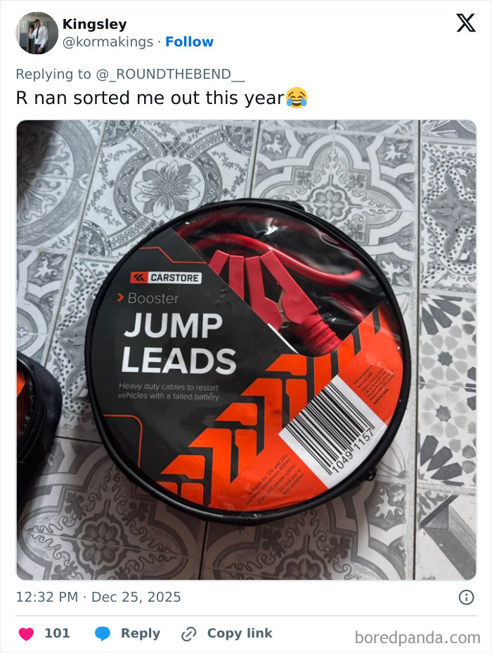 Jump leads in a round black case on patterned tile floor, an example of worst Xmas presents received this holiday.