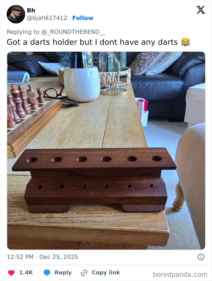 Wooden darts holder on table without any darts, illustrating one of the worst Xmas presents people received this holiday season.
