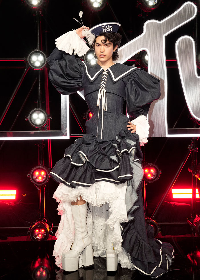 Person in an elaborate Victorian-inspired outfit and platform boots, illustrating celebrity fashion disasters 2025 trend.