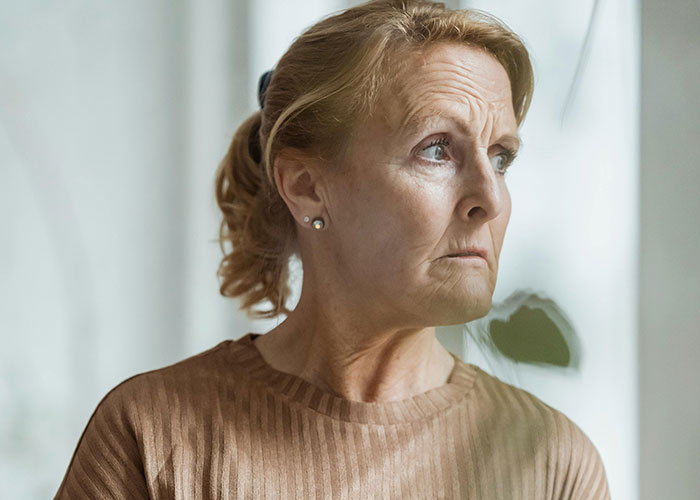Older woman looking concerned and upset, illustrating shock from unhinged things said by a mother-in-law.