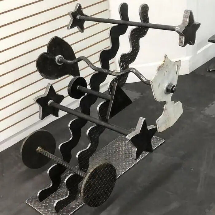 Abstract metal sculpture featuring stars, hearts, and wavy shapes, a trippy picture that seems plucked from another reality.