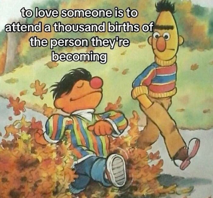 Two cartoon characters in colorful sweaters walking happily in autumn leaves, evoking sweet and wholesome vibes.