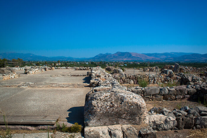 Ancient stone ruins under a clear blue sky, representing mysteries that we aren’t getting any closer to solving.