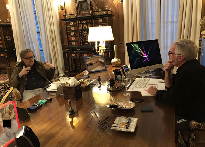 Two men in a lavish room with an ornate desk and computer, related to disturbing Epstein desk photo estate images controversy.